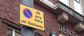 Pavement parking ban sign