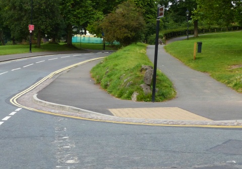 Wider context image of a dropped kerb crossing a side road