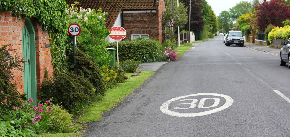 Speed limit repeater sign with roundel on the road