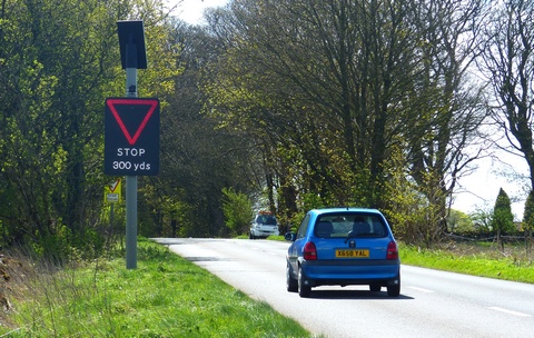 Vehicle activated sign - give way ahead with